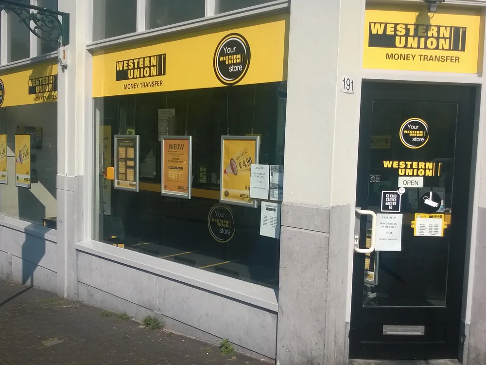 A money-transfer agent storefront on a city street